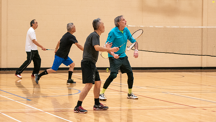 a group plays drop-in badminton after paying the updated rates for adult single admission in the 2026 fees and charges bylaw updates